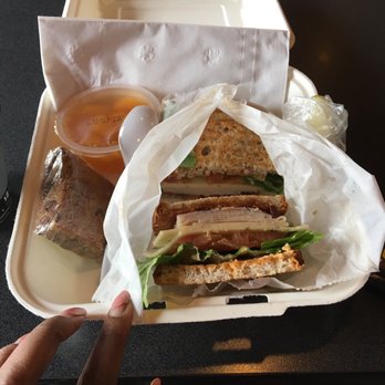 Carrigan Cafe - A Baja Club on GF Bread, blondie, and fruit cup on the side and peeking to the right is a pickle trying to make its mark. - Coffee & Tea Near Me - Saline, Michigan