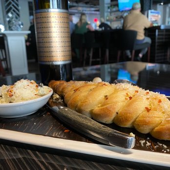 Plate - Garlic bread and truffle butter - Cocktail Bars Near Me - Kansas City, Missouri Plate - Garlic bread and truffle butter - Cocktail Bars Near Me - Kansas City, Missouri