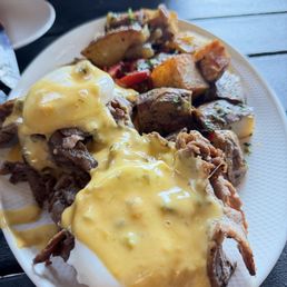 Prime Rib Benedict Get cheese sauce on the side. Tasted like velveta... better if it was smoked cheddar.