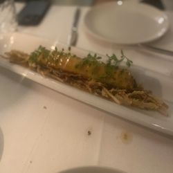 Antigua - Juicy, truffed and roasted chicken canellon, reduced in it's own juice on a fine cream of sweat potato pure with leek and foie chips