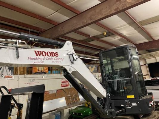 Woods Plumbing & Drain Cleaning Logo