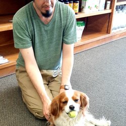 Vitamin Center - Ben, giving the best pet massage to one of our most favorite customers, Corky!