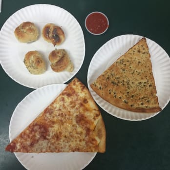 Rosario Pizza - a slice of cheese pizza on a paper plate - Pizza Near Me - Brooklyn, New York Rosario Pizza - a slice of cheese pizza on a paper plate - Pizza Near Me - Brooklyn, New York