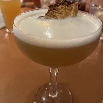 The Arrogant Butcher - Pineapple drink, first on the cocktail list. - American Near Me - Phoenix, Arizona The Arrogant Butcher - Pineapple drink, first on the cocktail list. - American Near Me - Phoenix, Arizona