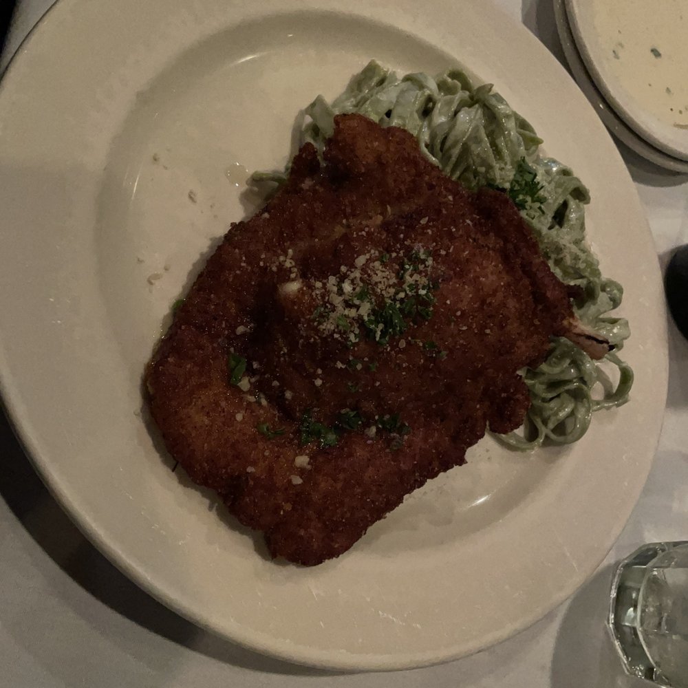 Cafe Tiramisu - Pork Lion Chop with fettuccine alfredo - Italian Near Me - Raleigh, North Carolina Cafe Tiramisu - Pork Lion Chop with fettuccine alfredo - Italian Near Me - Raleigh, North Carolina