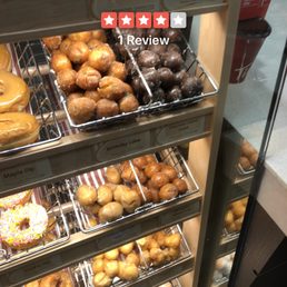 a variety of donuts in a display case a variety of donuts in a display case
