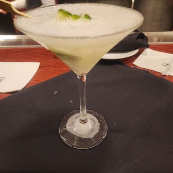 Fleming’s - Happy hour cucumber gin straight up on a frozen martini glass. - Steakhouses Near Me - Orlando, Florida