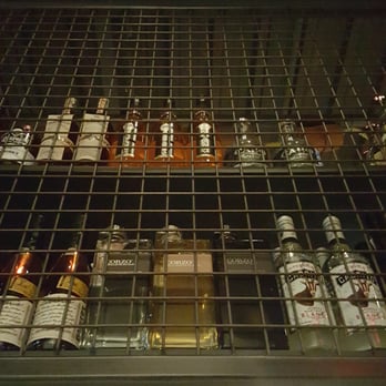 Plank Provisions - They have a massive cage that wraps around above the bar, packed full of booze! - Seafood Near Me - Omaha, Nebraska Plank Provisions - They have a massive cage that wraps around above the bar, packed full of booze! - Seafood Near Me - Omaha, Nebraska