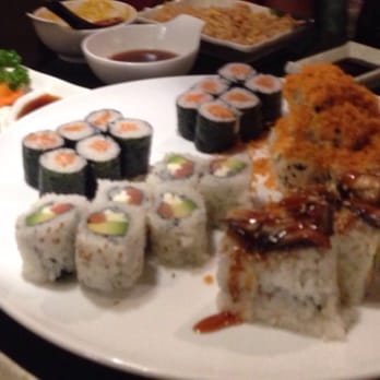 Sushi Ya - (Clockwise from top) 2 salmon rolls, volcano roll, Godzilla roll, Philadelphia roll. 2 orders Shumai on top left plate. - Japanese Near Me - Joliet, Illinois Sushi Ya - (Clockwise from top) 2 salmon rolls, volcano roll, Godzilla roll, Philadelphia roll. 2 orders Shumai on top left plate. - Japanese Near Me - Joliet, Illinois