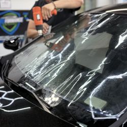 Proformance Tint & Vinyl - Alex Ramirez tinting a windshield @PROFormance Window Tint