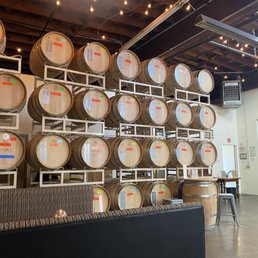 Tasting area, small tables sitting amongst the barrels Tasting area, small tables sitting amongst the barrels