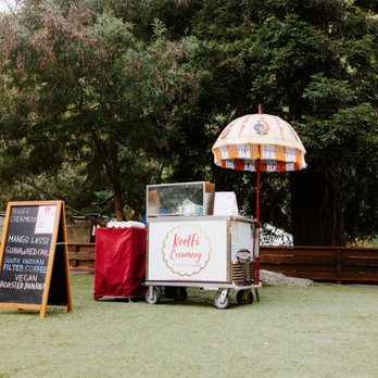 Koolfi Creamery - Cute ice cream cart setup with our four flavor choices displayed. - Ice Cream & Frozen Yogurt Near Me - San Leandro, California Koolfi Creamery - Cute ice cream cart setup with our four flavor choices displayed. - Ice Cream & Frozen Yogurt Near Me - San Leandro, California