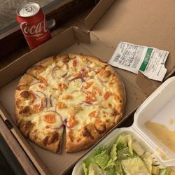Coach's Pizza - Build your own pizza and Caesar salad. I get this pizza with the garlic Parmesan base and I add tomatoes, feta cheese and red onion.