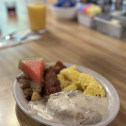 Silver Lake Resort Cafe - Biscuits and gravy, fisherman's special served with breakfast potatoes, eggs, bacon and a slice of watermelon.