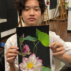 Teen student showcasing art work
