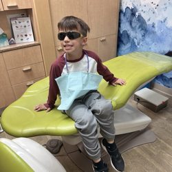 Great Whites Pediatric Dentistry & Orthodontics - Brody saying cheese to the camera after his cleaning.