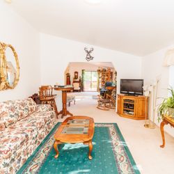 Serenity House Rental - T.V. room with plenty of puzzles, checkers game, and cards! Starlink fast WiFi for your favorite streaming, complimentary DISH & Netflex!