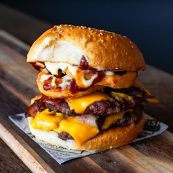 North Steyne Snack Shack - American Monster Burger: Chargrilled double beef patty, bacon, double american cheddar cheese, tomato, lettuce, red onion, onion rings, mayo