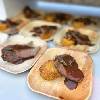 The Fruited Plain Caterers - Red wine-braised beef short ribs served on crispy parmesan polenta - Caterers Near Me - Parsippany, New Jersey The Fruited Plain Caterers - Red wine-braised beef short ribs served on crispy parmesan polenta - Caterers Near Me - Parsippany, New Jersey