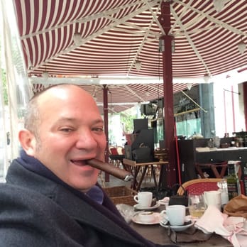 Cheri - Christopher Mey on the terrace of Cheri enjoying a Rocky Patel Edge Nicaragua Edition. - Spanish Near Me - Barcelona, B