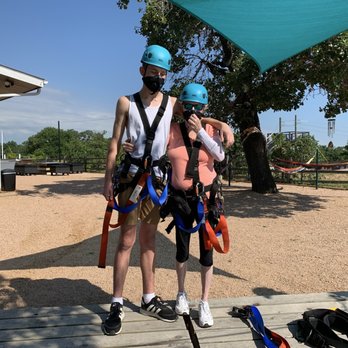 Zip Lost Pines - Myself and my 14 yo grandson strapped into our harnesses. - Ziplining Near Me - Cedar Creek, Texas