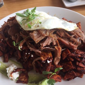 Early Bird - Chilaquiles with over easy eggs. A strange but tasty twist on this traditional Mexican breakfast dish! - New American Near Me - Fullerton, California Early Bird - Chilaquiles with over easy eggs. A strange but tasty twist on this traditional Mexican breakfast dish! - New American Near Me - Fullerton, California