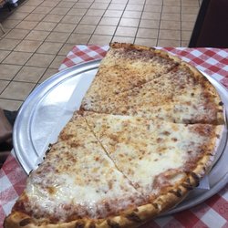 Millie's Kitchen - This is two slices. They're so big they cut them in half.
