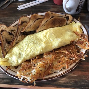 Seven Slot Grille - Irish omelette with Raisin toast crispy hash browns. - American Near Me - Reed City, Michigan Seven Slot Grille - Irish omelette with Raisin toast crispy hash browns. - American Near Me - Reed City, Michigan