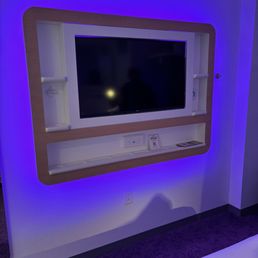 TV with built-in storage areas. TV with built-in storage areas.