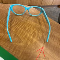 Pearle Vision - The temple is lifted off the table and is not In alignment with the other side.  Continuous adjustments are in vain.