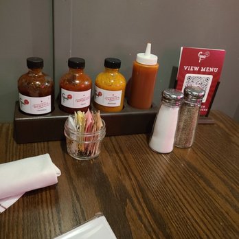 Gus's BBQ - Sauces on the table - Barbeque Near Me - Porter Ranch, California