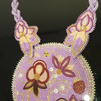 Textile Museum of Canada - a medallion necklace by Katie Longboat - part of the temporary exhibit "Beads, they're sewn so tight" on display at the Textile Museum. - Museums Near Me - Toronto, Ontario Textile Museum of Canada - a medallion necklace by Katie Longboat - part of the temporary exhibit "Beads, they're sewn so tight" on display at the Textile Museum. - Museums Near Me - Toronto, Ontario