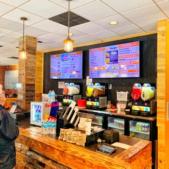 Eh! Burger - a man standing at the counter - Burgers Near Me - Munising, Michigan
