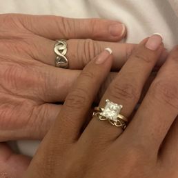 We made infinity wedding bands and the engagement ring is a 2.1c princess cut solitaire.