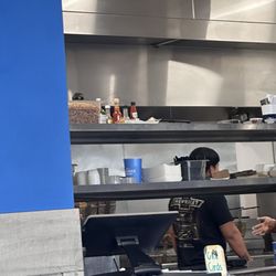 Boardwalk Fries & Burgers - Hot sauce on kitchen shelf.