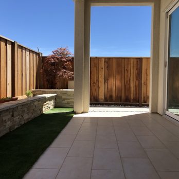 Nine Orange Landscaping - Tiles with artificial lawn and retaining wall - Landscaping Near Me Nine Orange Landscaping - Tiles with artificial lawn and retaining wall - Landscaping Near Me