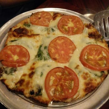 Exchequer Restaurant & Pub - Thin crust, fresh spinach and tomatoes...yumm! - Pizza Near Me - Chicago, Illinois
