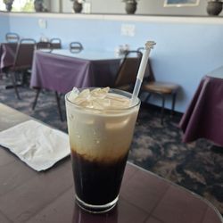 Iced Thai coffee and interior. We had a booth.