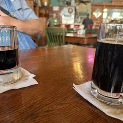 The root beer is served in frosty mugs