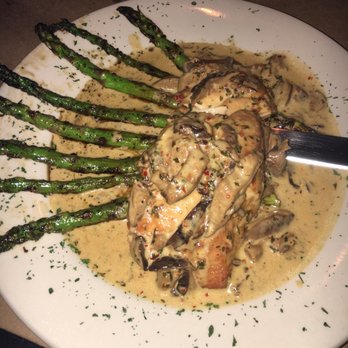 Tango Sur - Pez with mushroom sauce and asparagus. - Latin American Near Me - Chicago, Illinois Tango Sur - Pez with mushroom sauce and asparagus. - Latin American Near Me - Chicago, Illinois