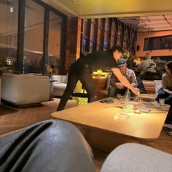 Merchant and Trade - The waiter servicing the people across from us, while ignoring us every chance he got