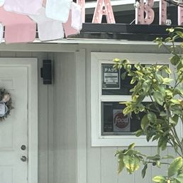 Door to Aloha Bites with sign. Door to Aloha Bites with sign.