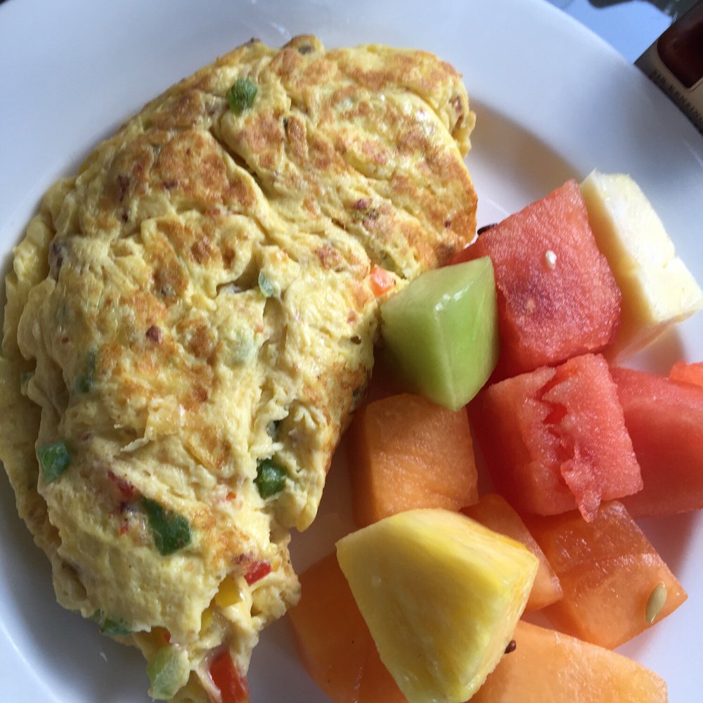 Oscar's - Omelet with peppers and cheese alongside fresh fruit - American Near Me - Orlando, Florida Oscar's - Omelet with peppers and cheese alongside fresh fruit - American Near Me - Orlando, Florida
