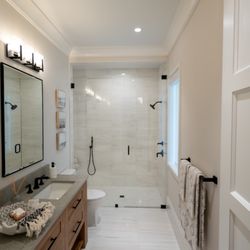 IDEAL Shower Doors - IDEAL Pivot door & panel using IDEAL Crystal Clear Glass