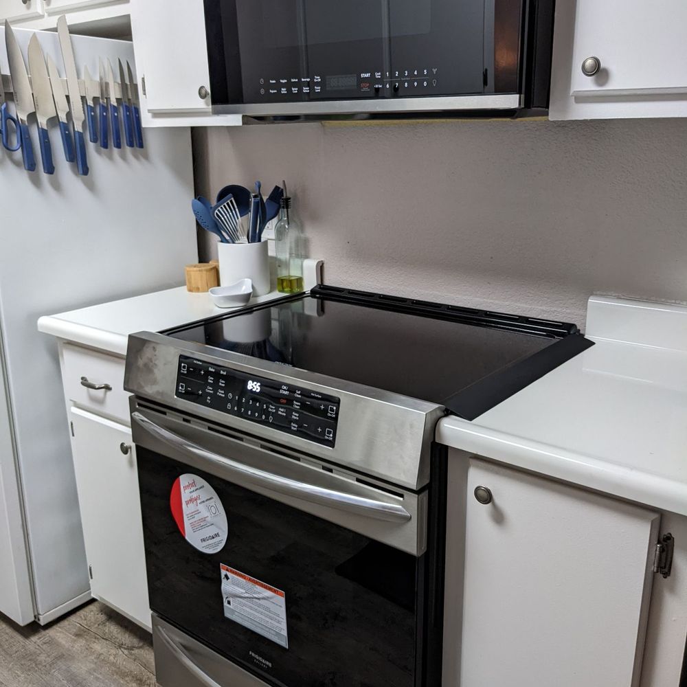 New Frigidaire range and over the range microwave. Microwave installed securely by Luis New Frigidaire range and over the range microwave. Microwave installed securely by Luis