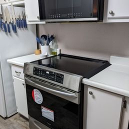 New Frigidaire range and over the range microwave. Microwave installed securely by Luis