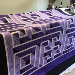 Aurora Quilts - Custom quilting on a Labyrinth Walk quilt pattern. Love the 3D look the quilting enhances the 3D appearance.