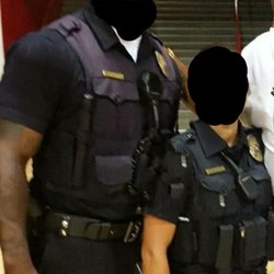 The Vest Man - Vest man's carrier is on the left, (different brand on right).. Almost looks purple and doesn't blend in at all with the shirt.