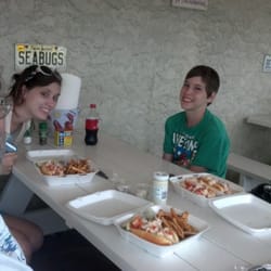 Four lobster rolls...two were platters... At the picnic tables outside.