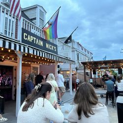 Captain Nick's Rock N' Roll Bar - Outdoor bar area with stage for musician